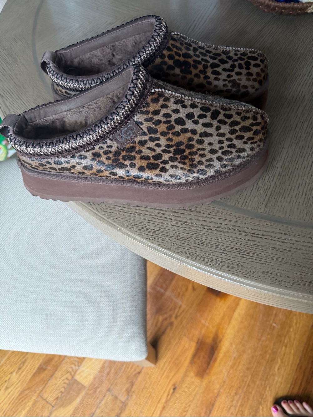 UGG women’s Leopard Print Slip-Ons in Brown and Black